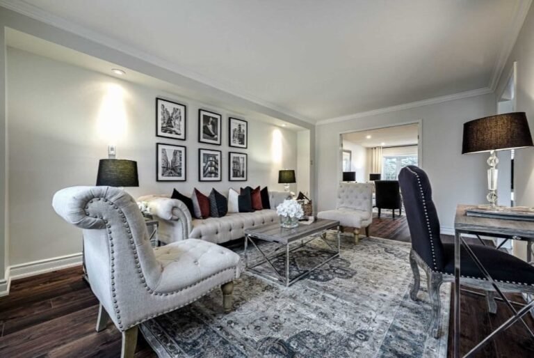 Completed living room renovation with wood flooring and recessed lighting