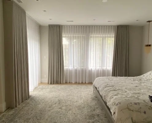 Tailored Coverings installation in a Toronto bedroom with layered drapery